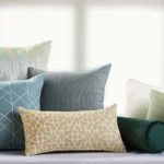 A group of decorative throw pillows featuring a variety of colors and patterns.