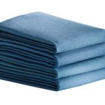 A stack of four folded PerVal Surgical Towels.