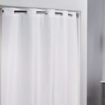 Image of a white grommeted hotel shower curtain.