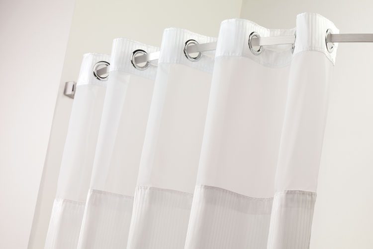 A detail shot of a Dobby Stripe Hookless Chrome Sheer Window shower curtains for hotels.