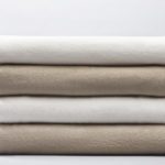 Stack of 4 100% polyester blankets wholesale in white and beige