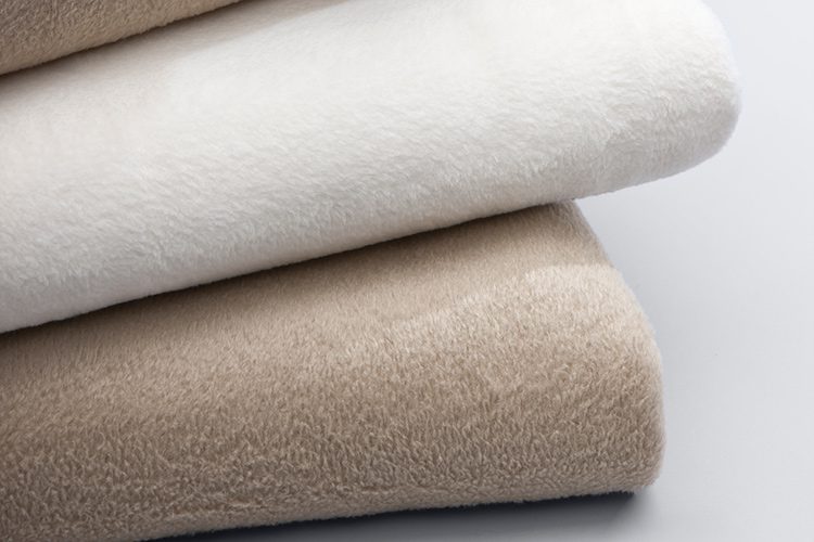 Stack of 3 100% polyester blankets wholesale