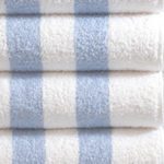 A stack of four classic Cabana Stripe Pool Towels.