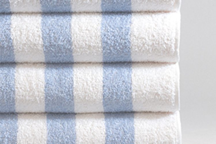 A stack of four classic Cabana Stripe Pool Towels.