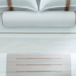 Two standard pillows, decorative pillow, and TAL designer sheets in Concerto