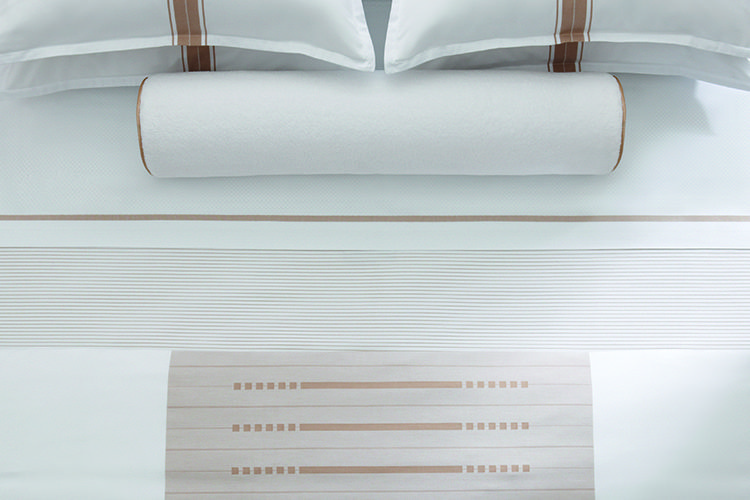 Two standard pillows, decorative pillow, and TAL designer sheets in Concerto