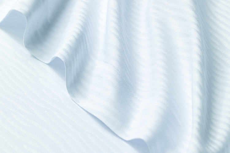 TAL Designer sheet with wavy lines, or Dune design.