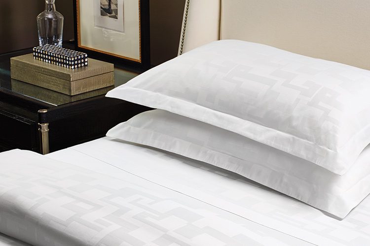 A white hotel sheets in the TAL design line and in the Braque pattern.