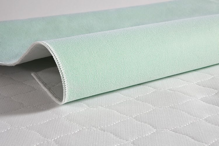 A detail shot of TruVal underpads. These incontinence bed pads are a special class of novel cross-section yarns that dramatically enhance wicking performance.