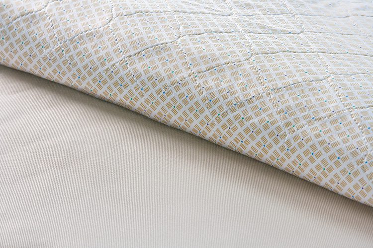 A detail show of Twill Print underpads. The attractive print on these incontinence pads are designed to make it less obvious that an underpad is being utilized.