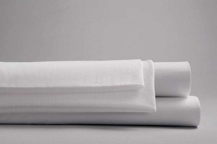 A stack of versatility fitted sheets