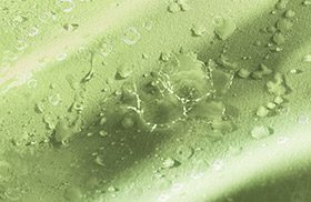This image shows water beading on fabric. Impact technology makes fabric is water-resistant.