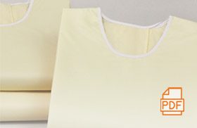 This image shows a stack of Compel© Isolation Gowns.