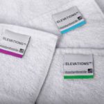 A detail shot of several Bath towels with EZ ID color coded labels.