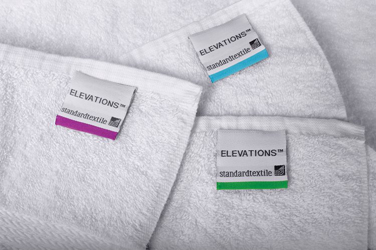 A detail shot of several Bath towels with EZ ID color coded labels.