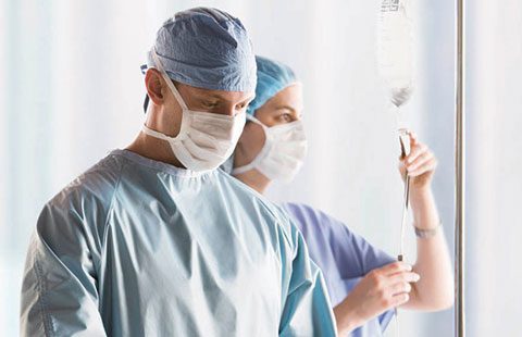 Hospital staff dressed for surgery.