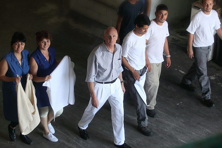 President and CEO Gary Heiman walking with a group of other Standard Textile team members.