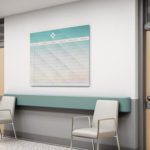Image is of a large Clarus Board in a hospital corridor.
