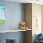 The image is of a Clarus Board with a fun cartoon graphic behind the glass. It is a pediatric hospital room.