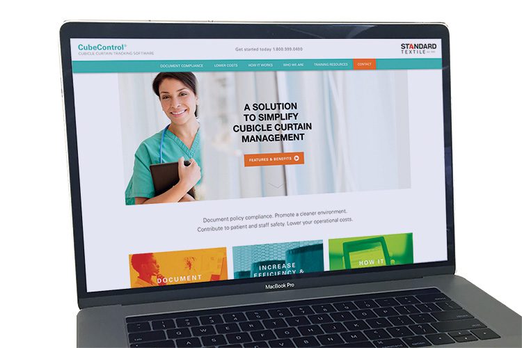 A laptop screen showing the landing page for the Cube Control website.