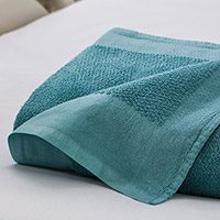 Hospital blanket Folded Dual Cover® in Teal shown on a hospital bed | Healthcare Blankets & Spreads