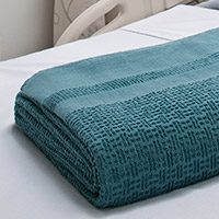 Folded Insulite Hospital Blanket on hospital bed | Healthcare Blankets & Spreads