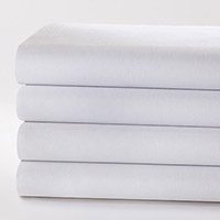 Images shows a stack of white sheets. PerVal® sheeting is engineered for softness and durability.