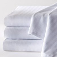 This stack of white sheets offers a woven tone-on-tone pattern.