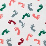 A cute baby receiving blanket featuring tiny footprints.
