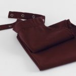 Linen clothing protector for adults that can be snapped around the neck and then laundered.