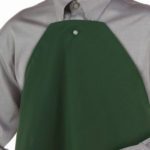 A person wearing a clothing protector that features a button-hole to easily attach to a button down shirt or blouse.