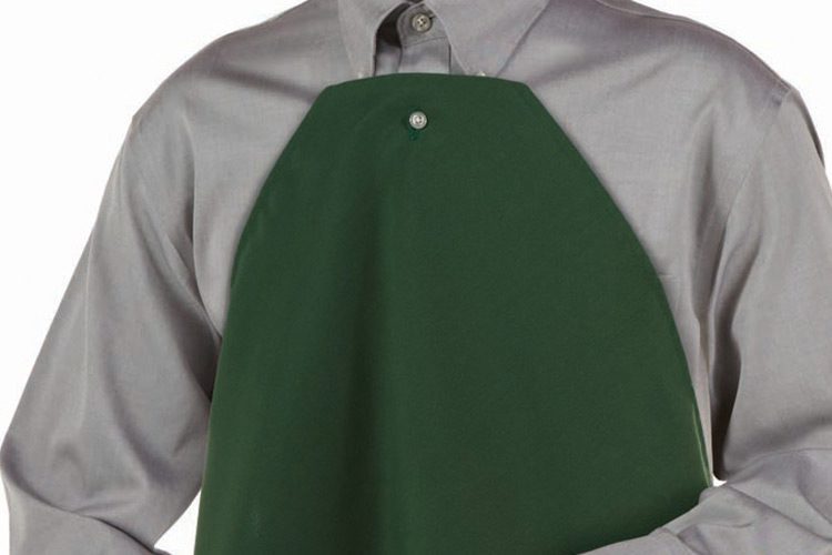 A person wearing a clothing protector that features a button-hole to easily attach to a button down shirt or blouse.