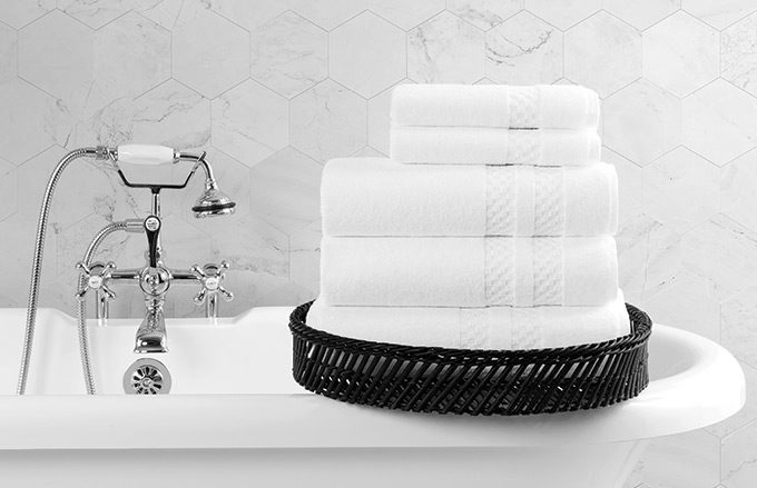 Stack of towels on bathtub