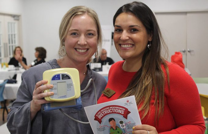 two happy ladies after checking blood pressure