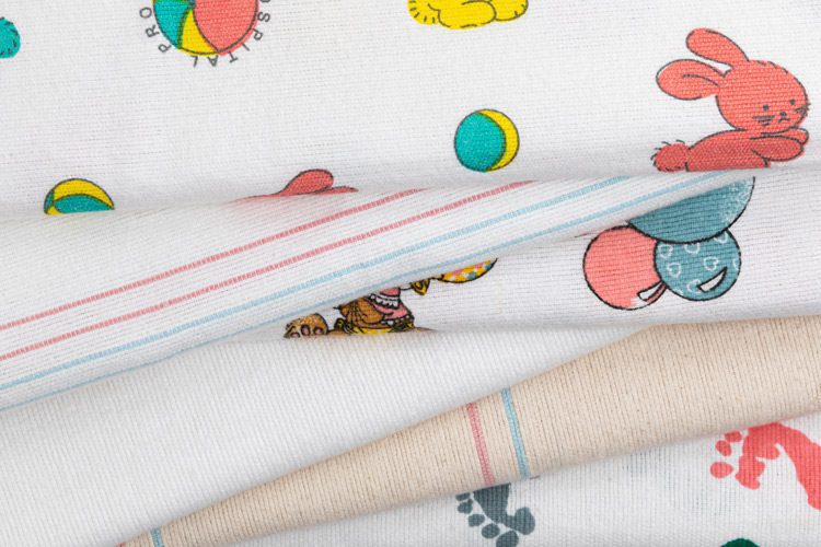 This image shows an assortment of Standard Textile's hospital receiving blankets. These hospital blankets for babies are as durable as they are soft. Our infamous hospital swaddle blankets frequently appear in most newborn baby's first photo ops.