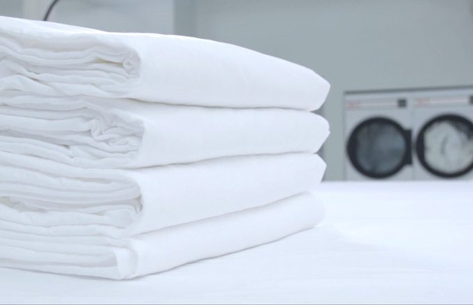 Folded Stack of Sheets in Commercial Hotel Laundry