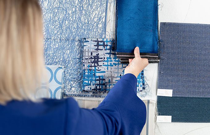 Designer coordinating a collection blue Standard Textile fabrics.