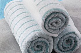 stacked of rolled pool towels