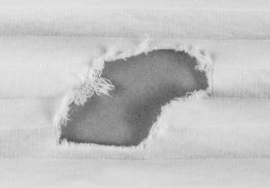 Example of chemical damage on a 100% Cotton Sheet