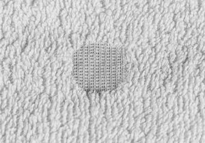 Example of chemical damage on a Poly-Cotton Blended Towel