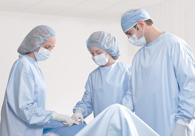 Healthcare workers in compel protective apparel