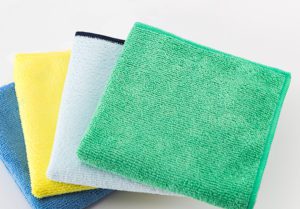 A stack of various color microfiber cleaning cloths.