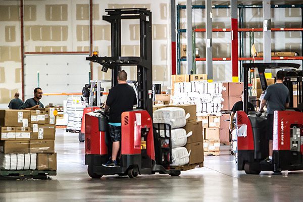 Forklift operator moving product at the Standard Textile distribution center in Hebron, Kentucky.