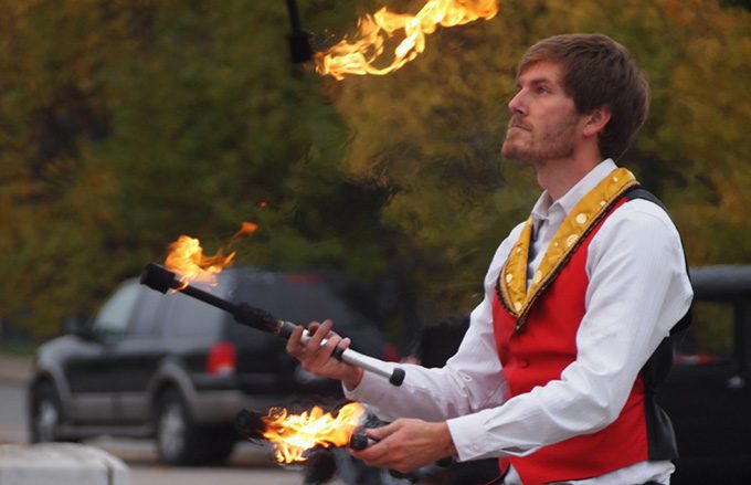 Circus performer juggling fire