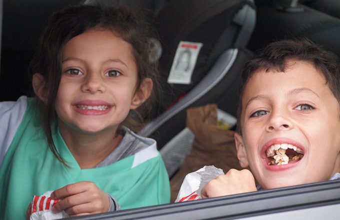 Kids in car smiling