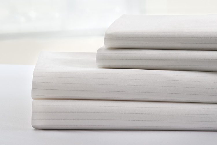 Stack of DermaTherapy sheets and pillowcases