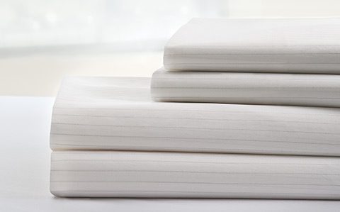 Photo of a stack of DermaTherapy® bedding linens.