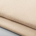 Stack of peach bath blankets.