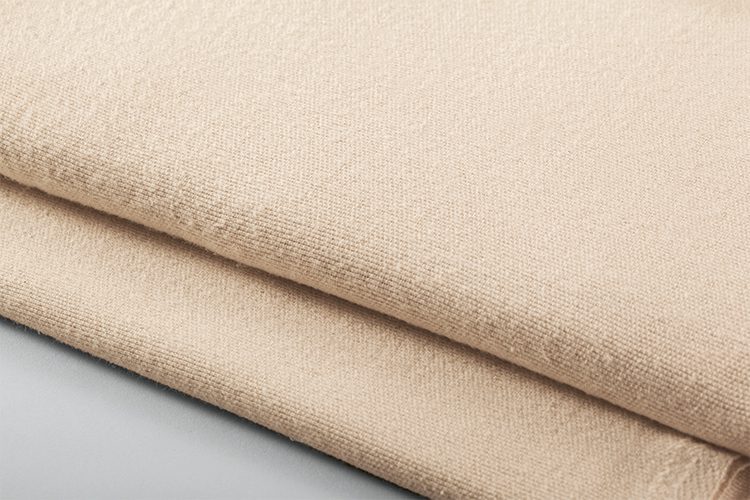 Stack of peach bath blankets.