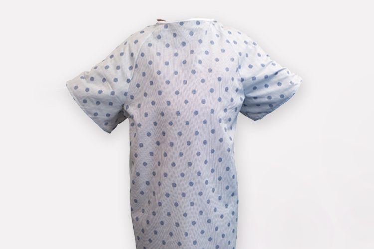 A floating image of patient gown. Standard Textile offers hospital gowns in a variety of sizes and patterns. Custom patient gowns are also available.